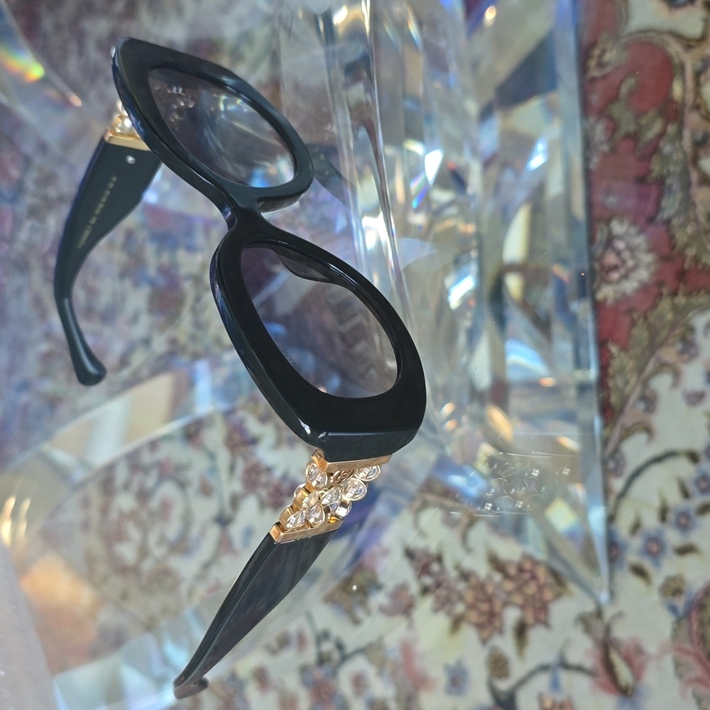 Elegant Black CHANEL Sunglasses with Gold Accents
